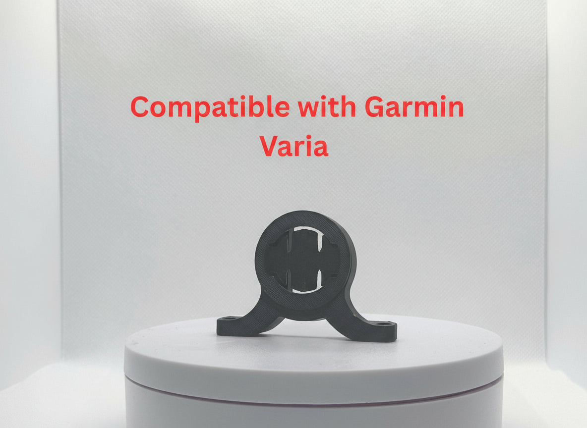 Black device on a white platform with 'Compatible with Garmin Varia' text above.